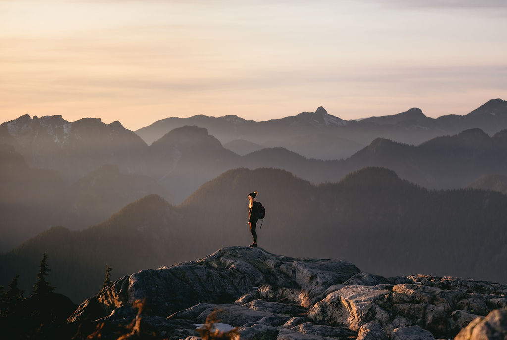 Girl standing on top of Mount Seymour